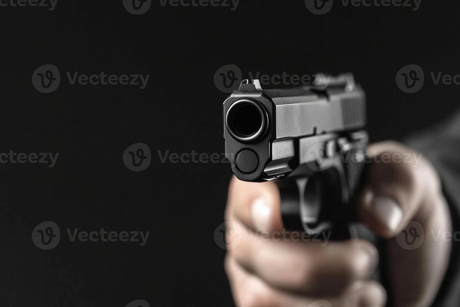 A person holding a gun in their hand photo