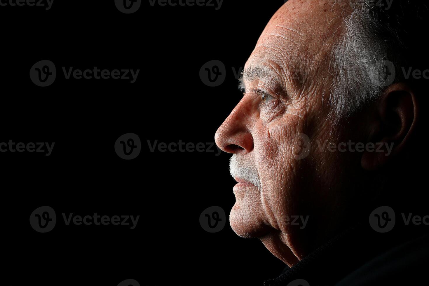A man with a mustache and a black background photo