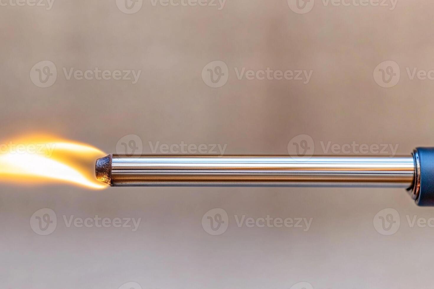 A close up of a torch being used to light a cigarette photo