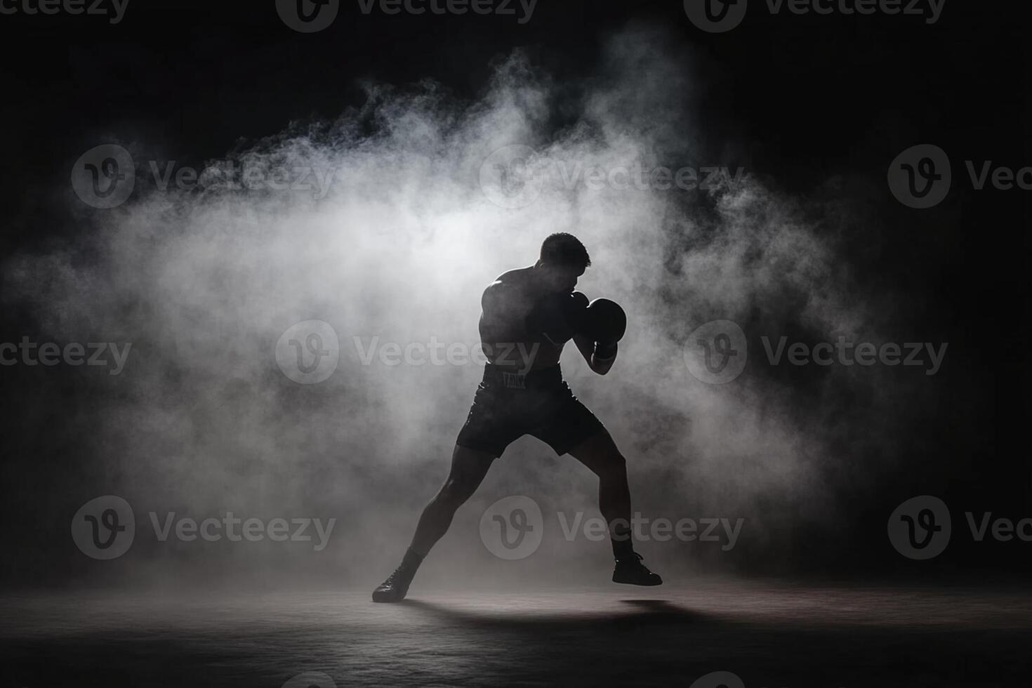 A man in boxing gear is silhouetted in the smoke photo