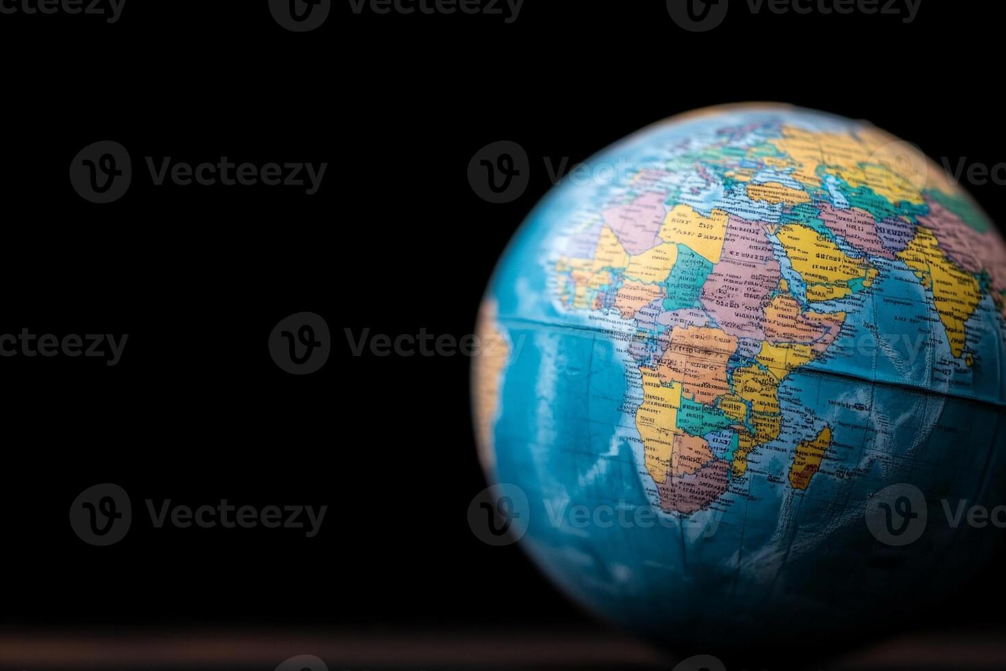 A globe on a black background with a black background photo