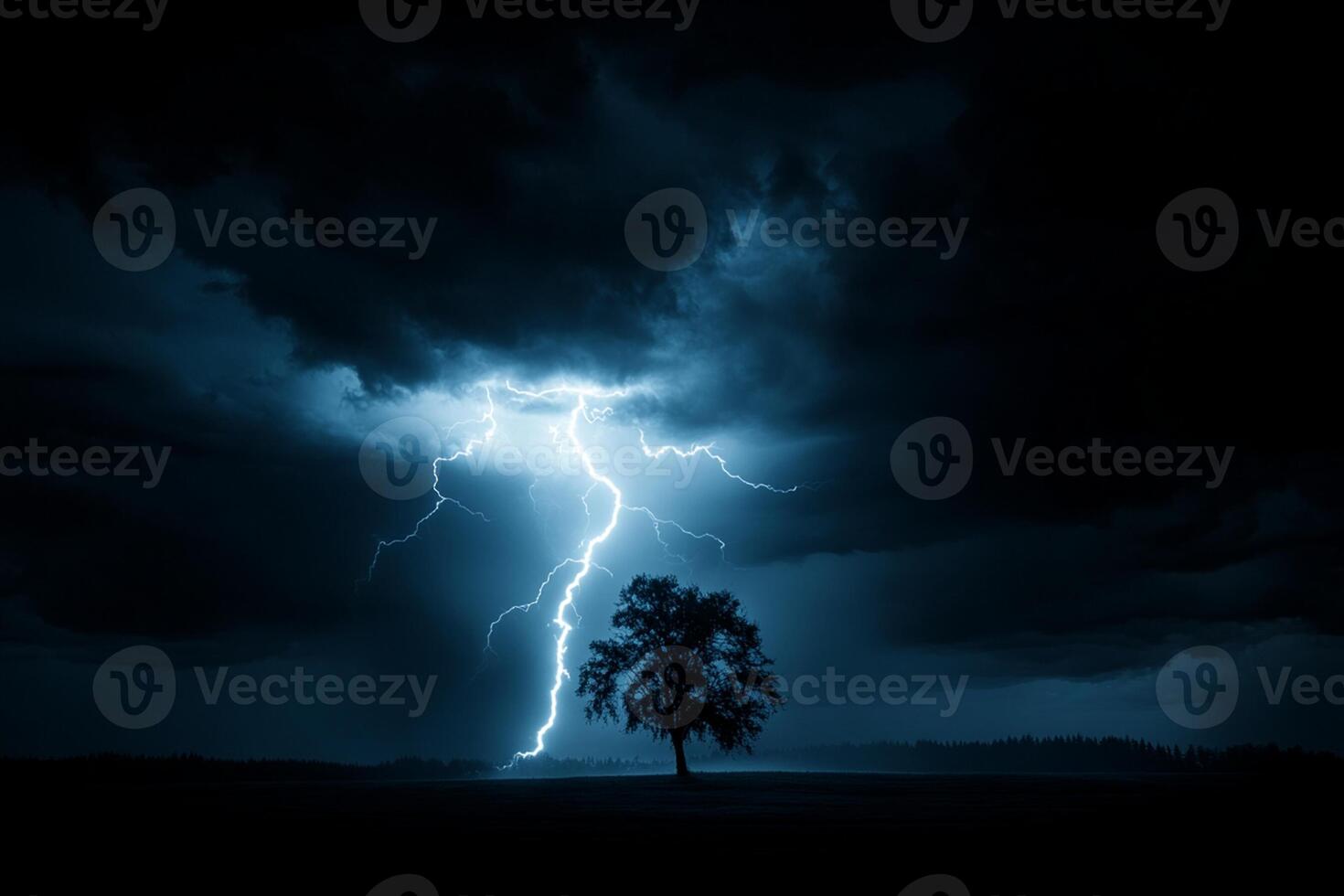 A lightning bolt strikes a tree in the dark photo
