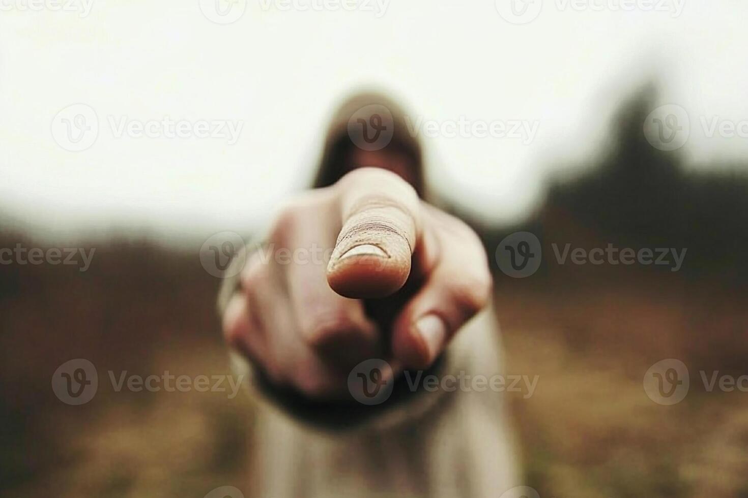 A person pointing at something with their finger photo