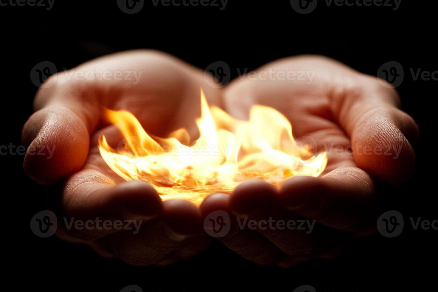 A person holding a flame in their hands photo