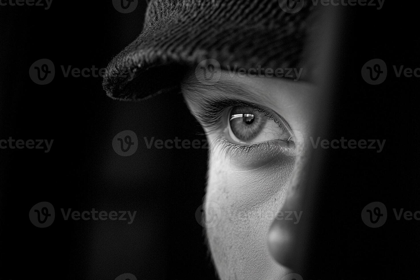 A close up of a young boy wearing a hat photo