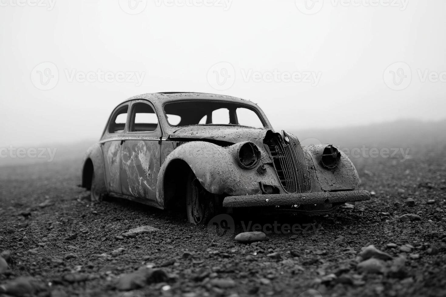 An old car sits in the middle of a field photo