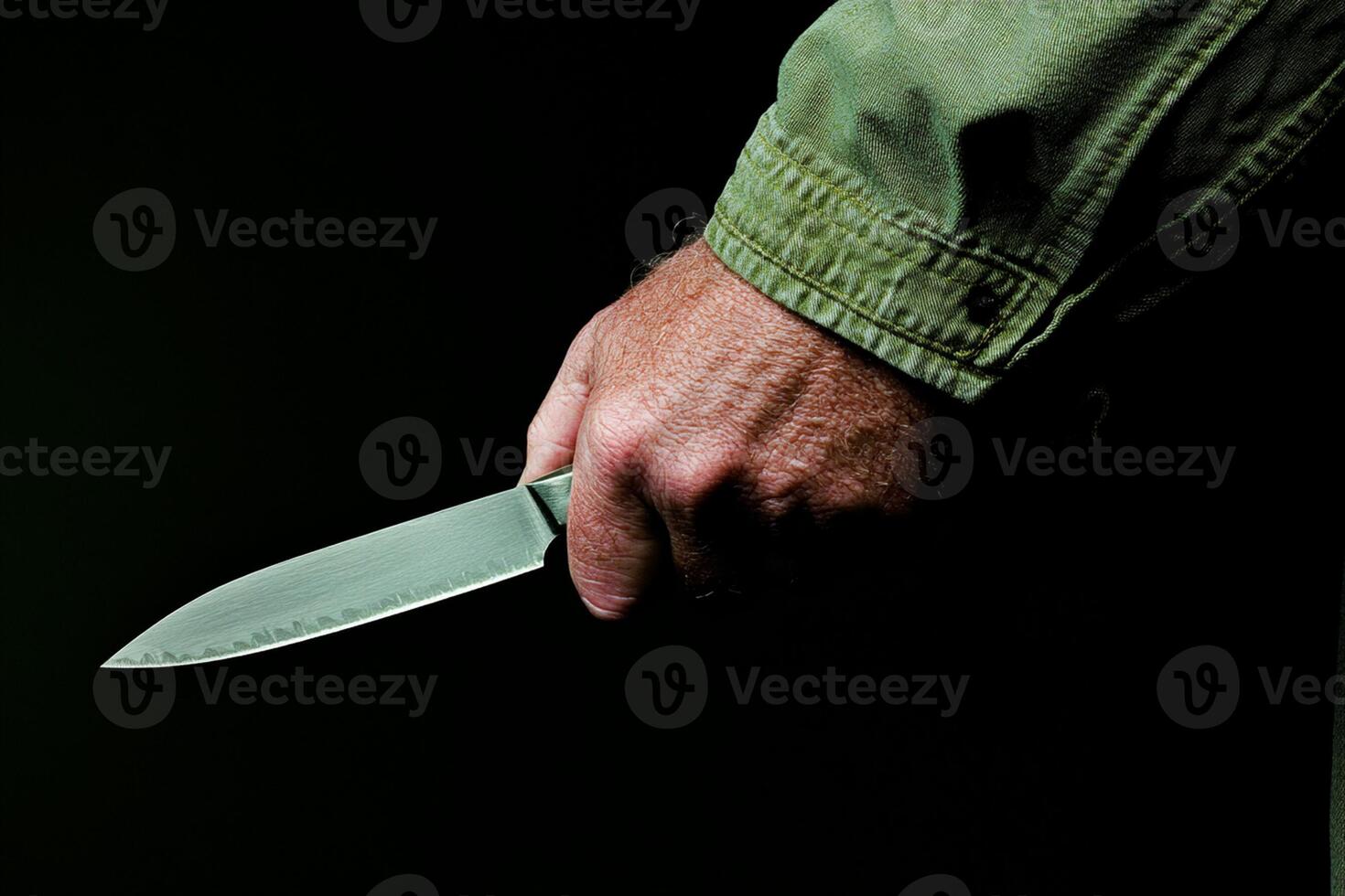A man holding a knife in his hand photo