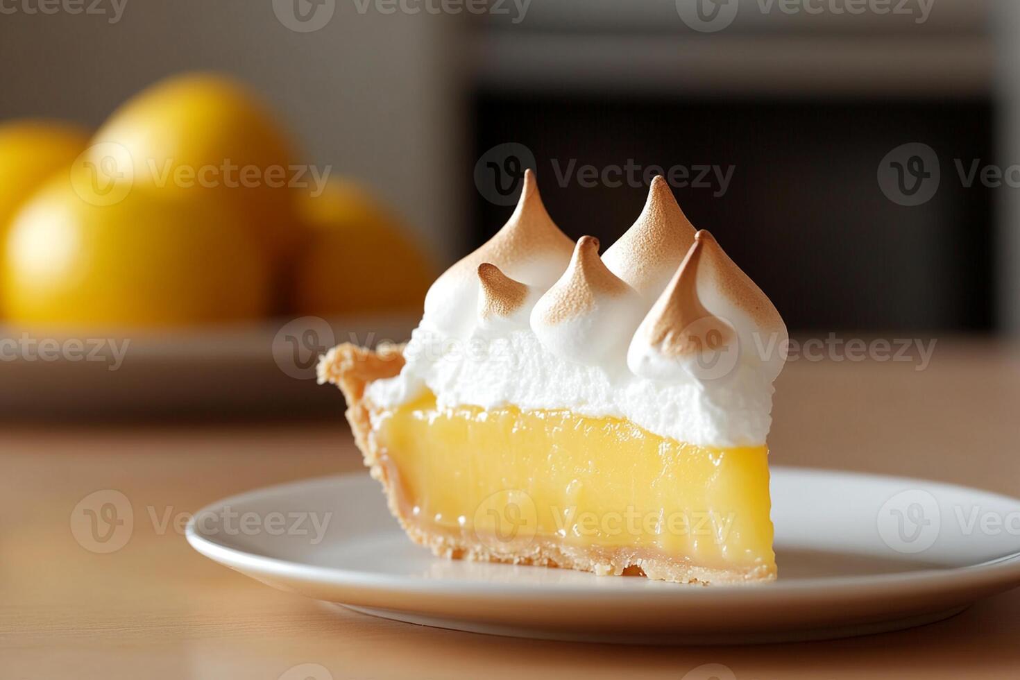 A slice of lemon meringue pie on a plate photo
