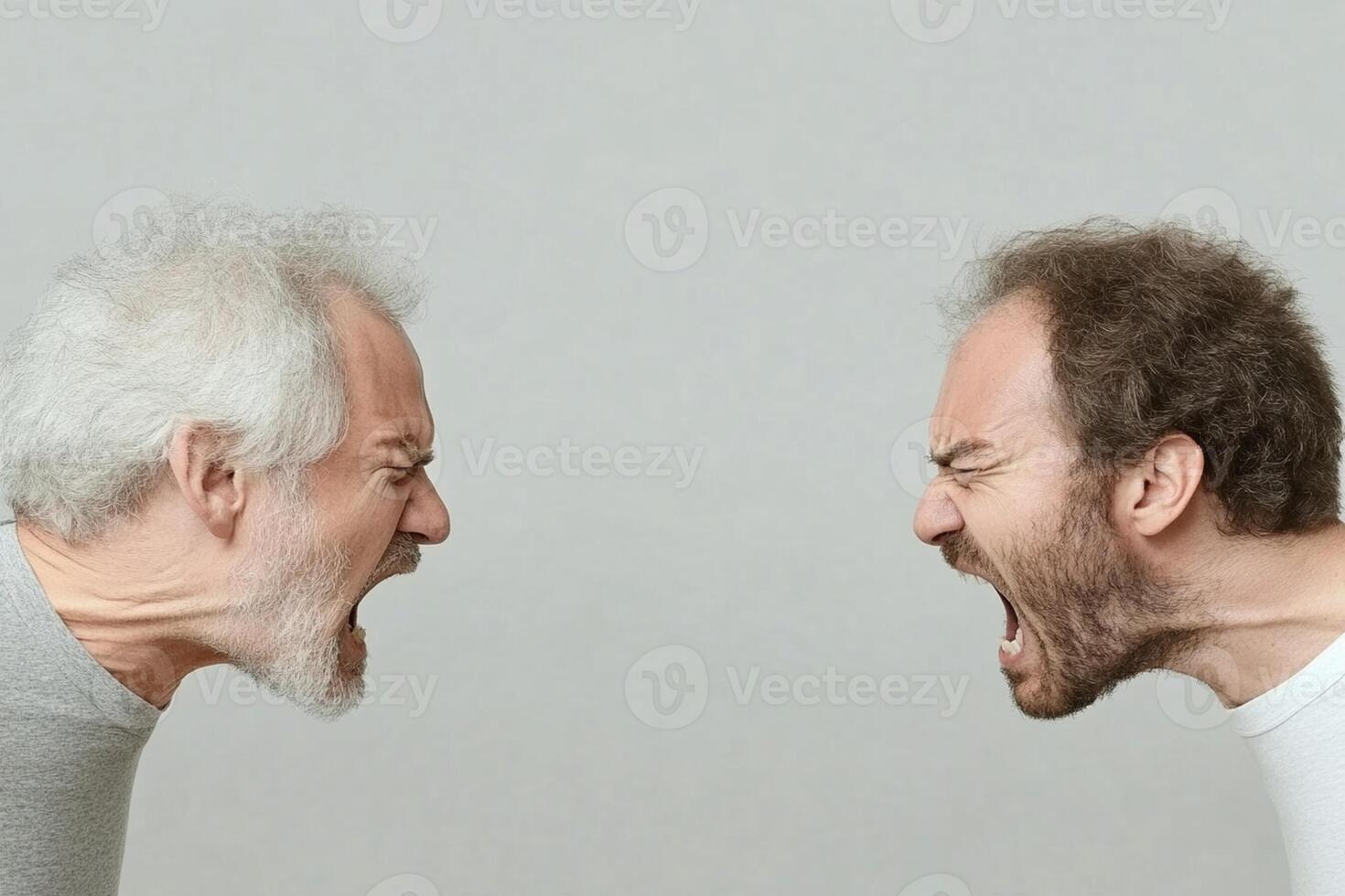 Two men with angry faces on a gray background photo
