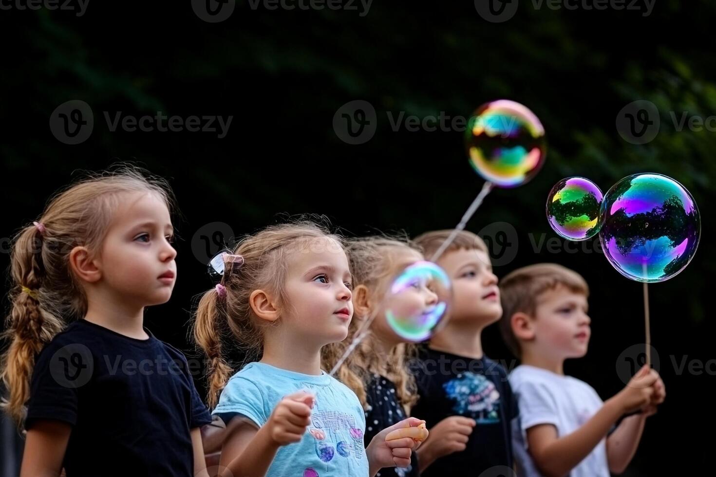A group of children holding soap bubbles photo