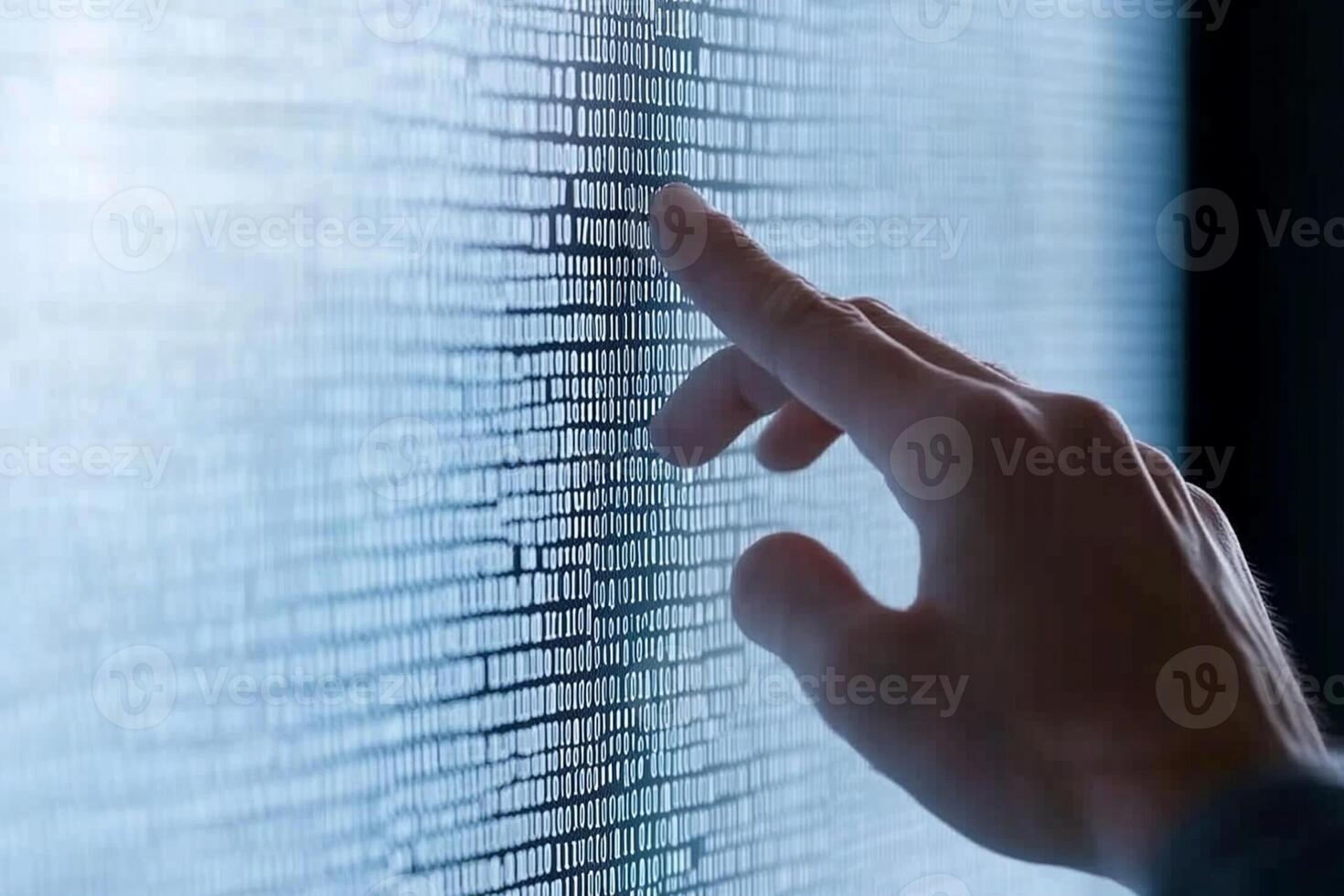 A person touching a screen with a finger photo