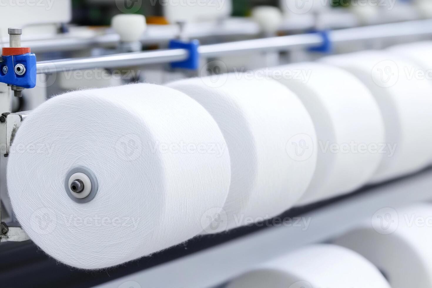 A machine with white yarn on it photo
