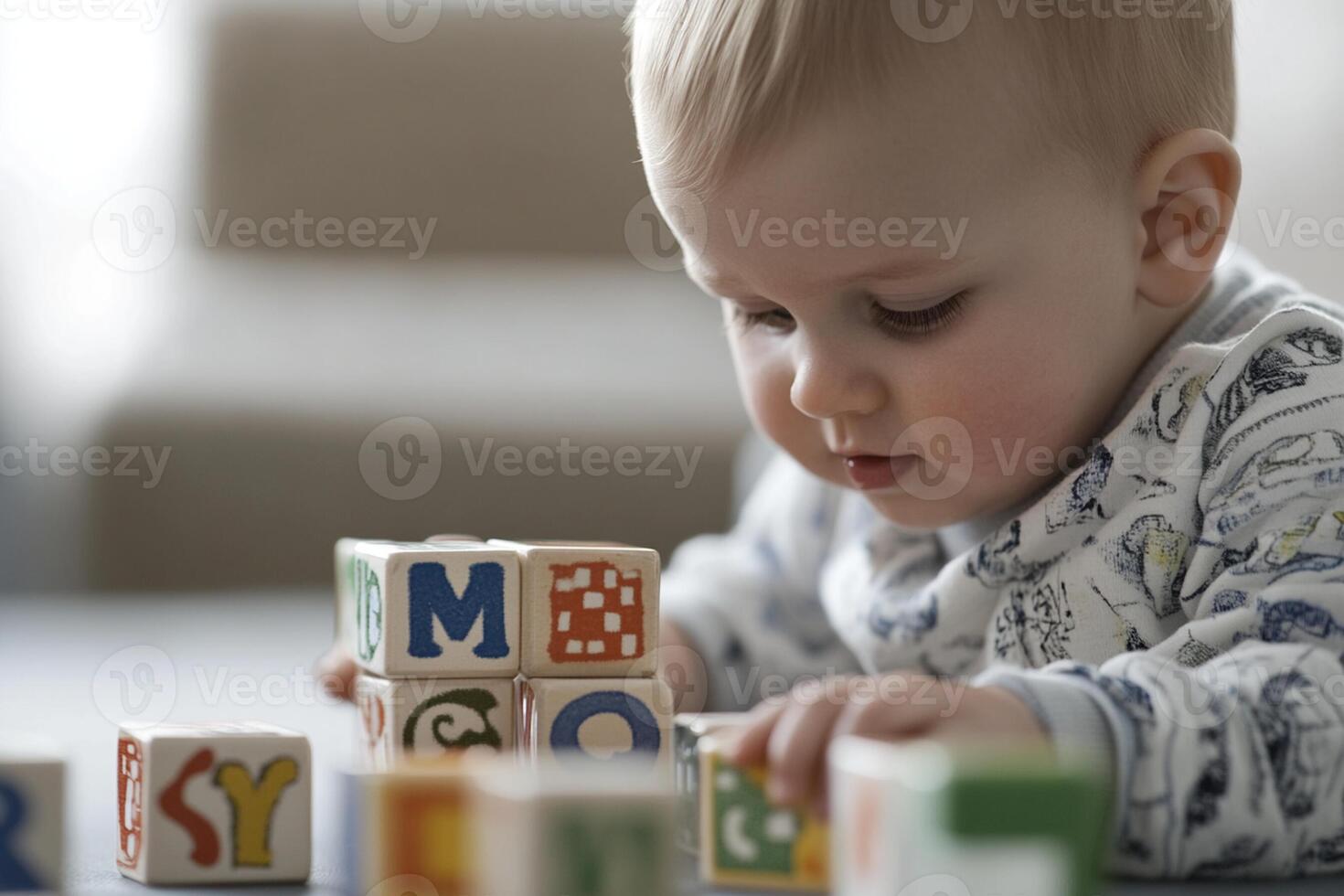 A baby playing with blocks on a table photo