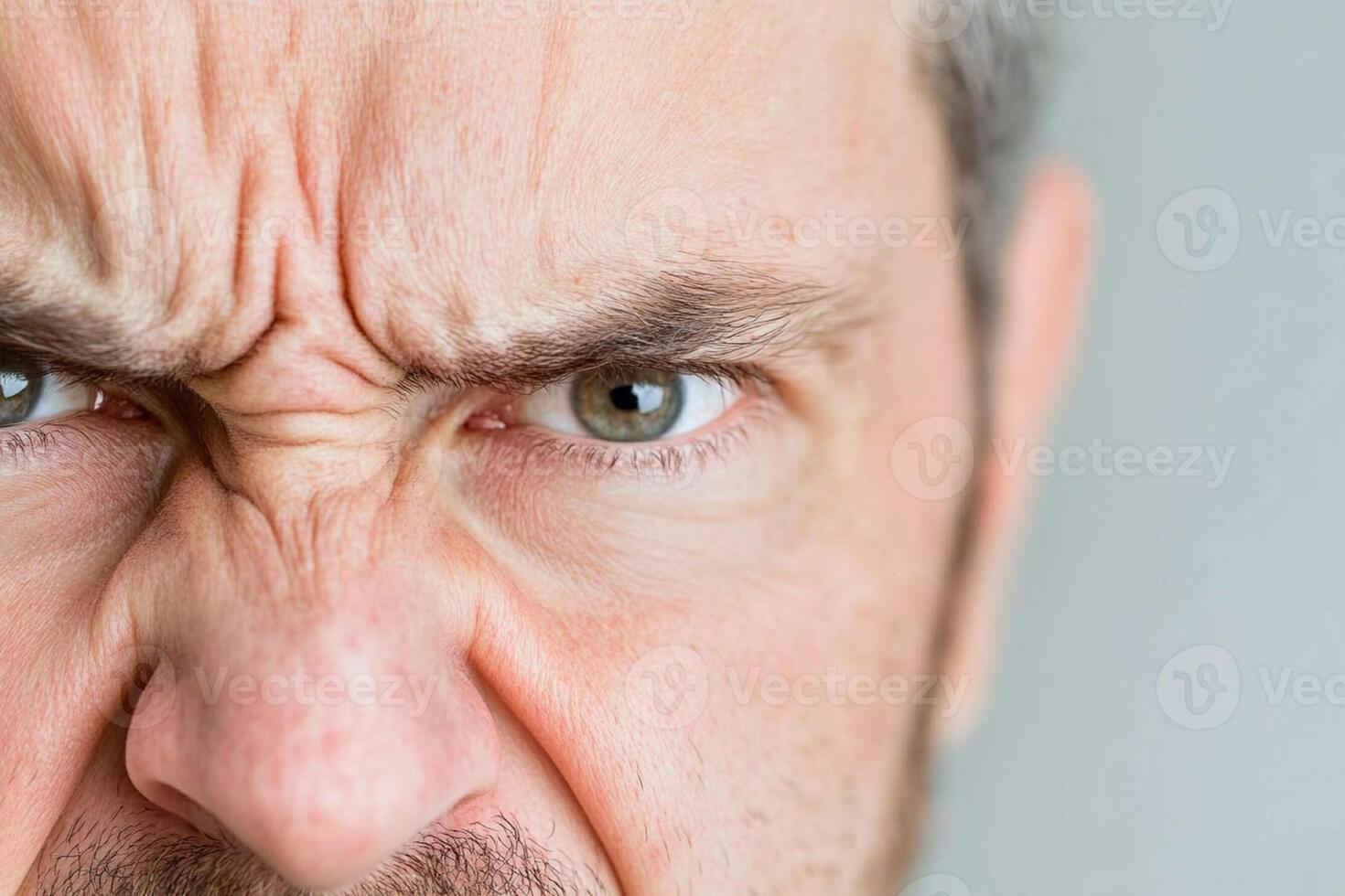 A man with a serious expression on his face photo