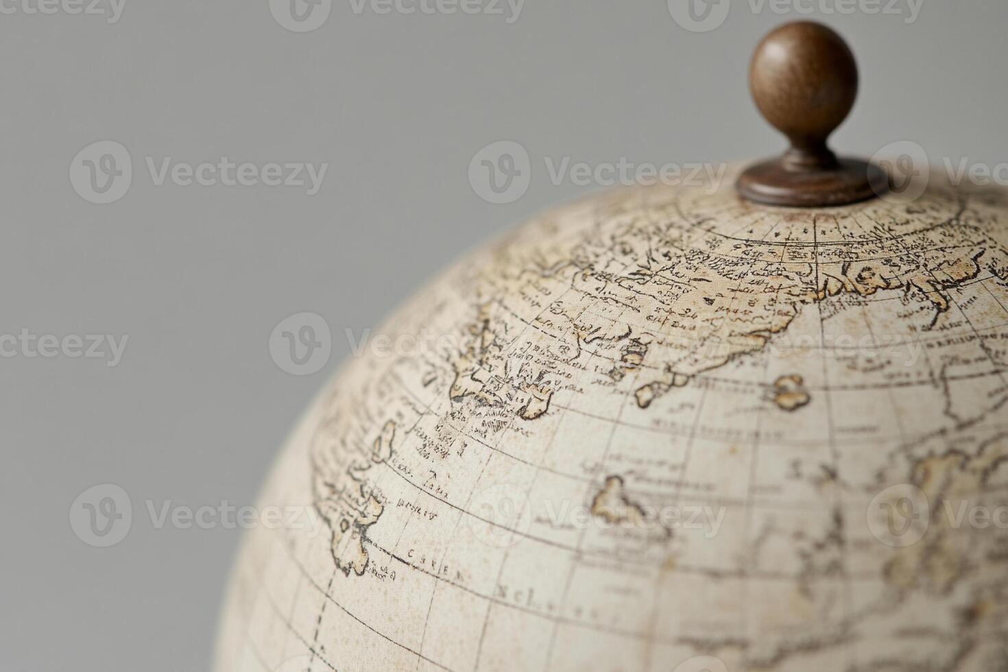 A close up of a globe with a wooden top photo