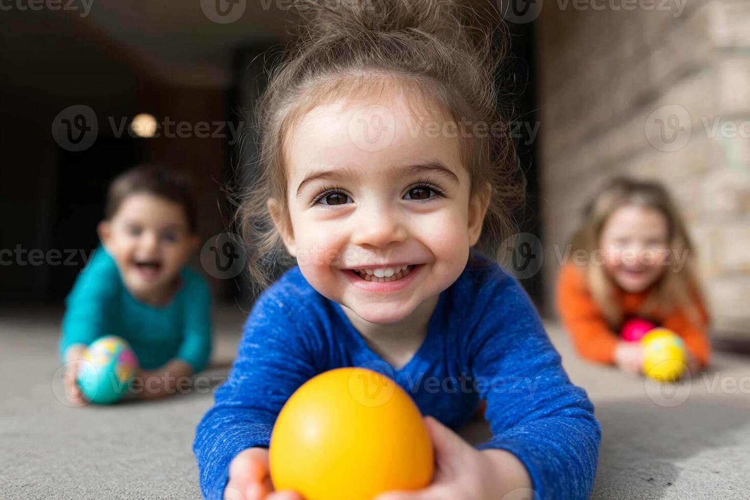 A young girl smiles while holding an easter egg photo