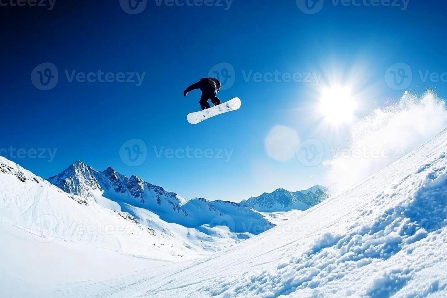 A snowboarder in the air over a snowy slope photo