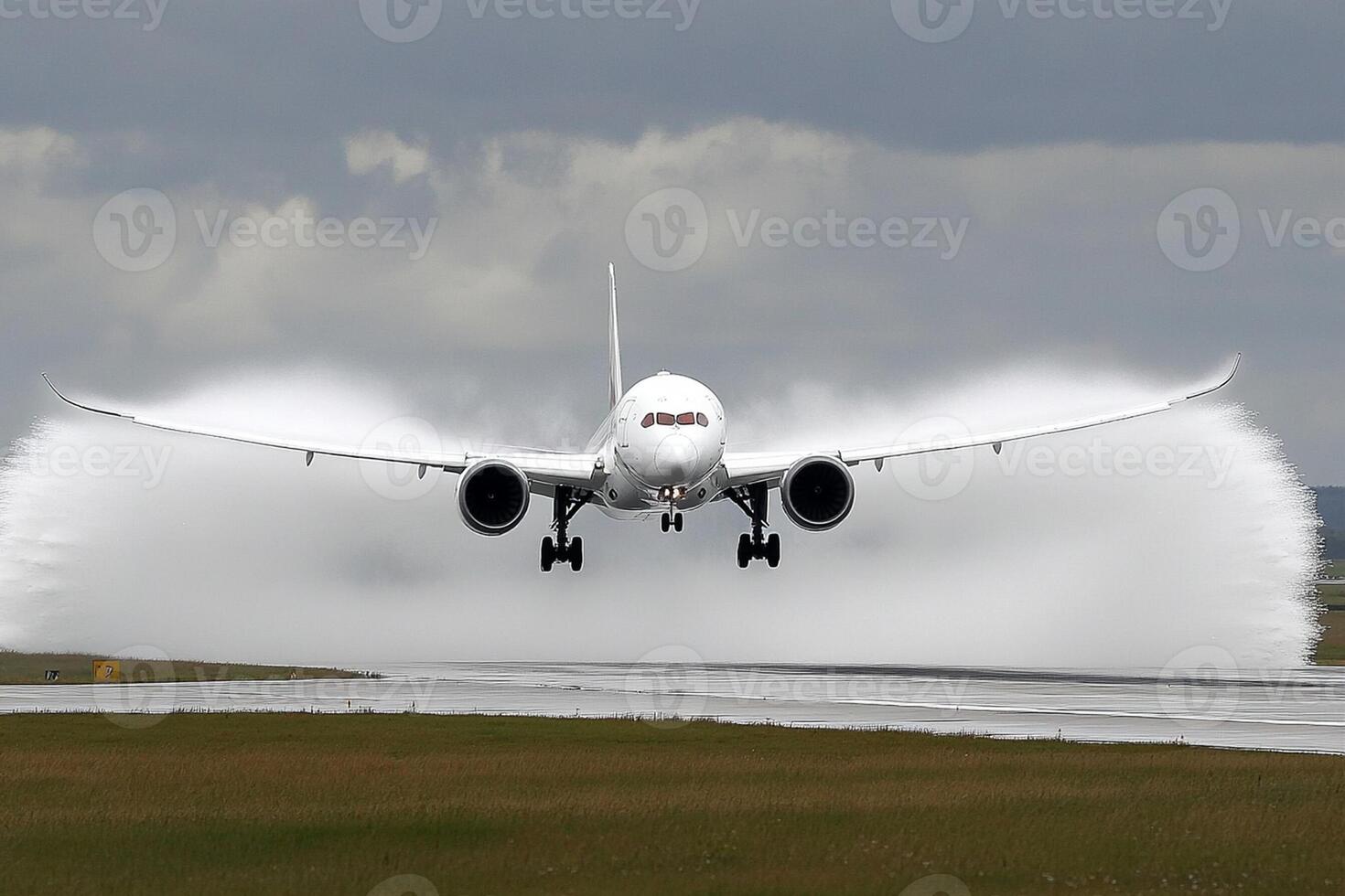 A large jet plane taking off from an airport photo