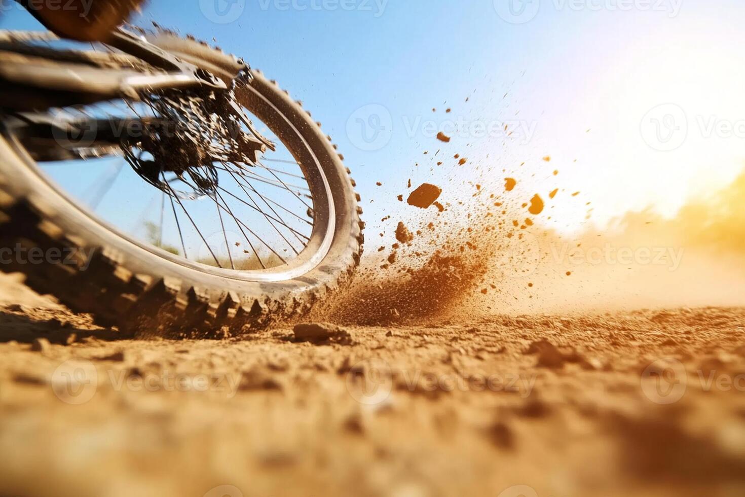 A dirt bike is riding on the dirt road photo