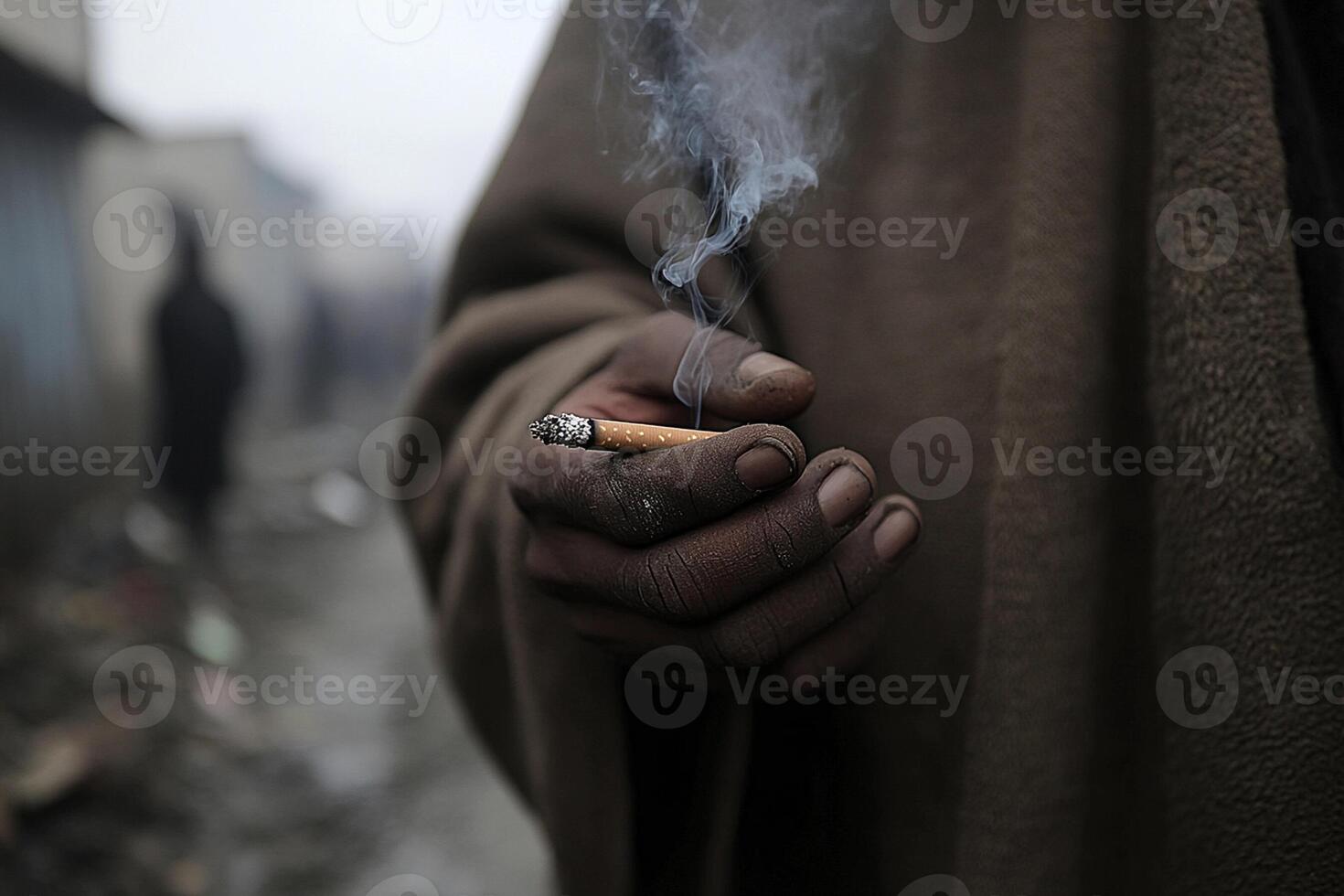 A man holding a cigarette in his hand photo