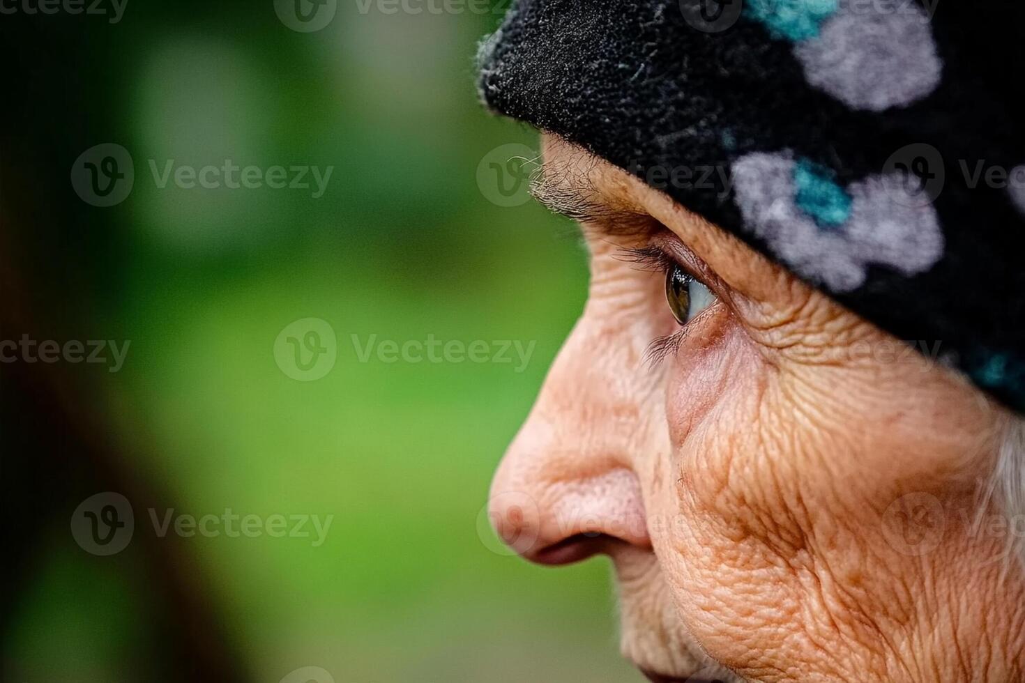 An old woman with a hat on her head photo