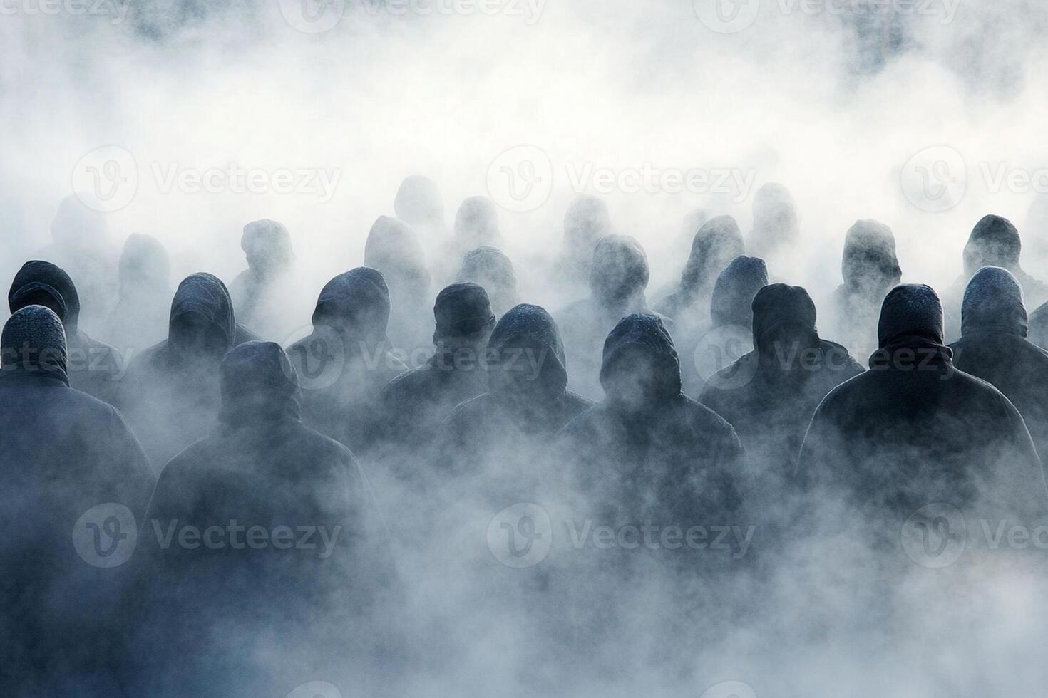 A group of people in black hoods are standing in the fog photo