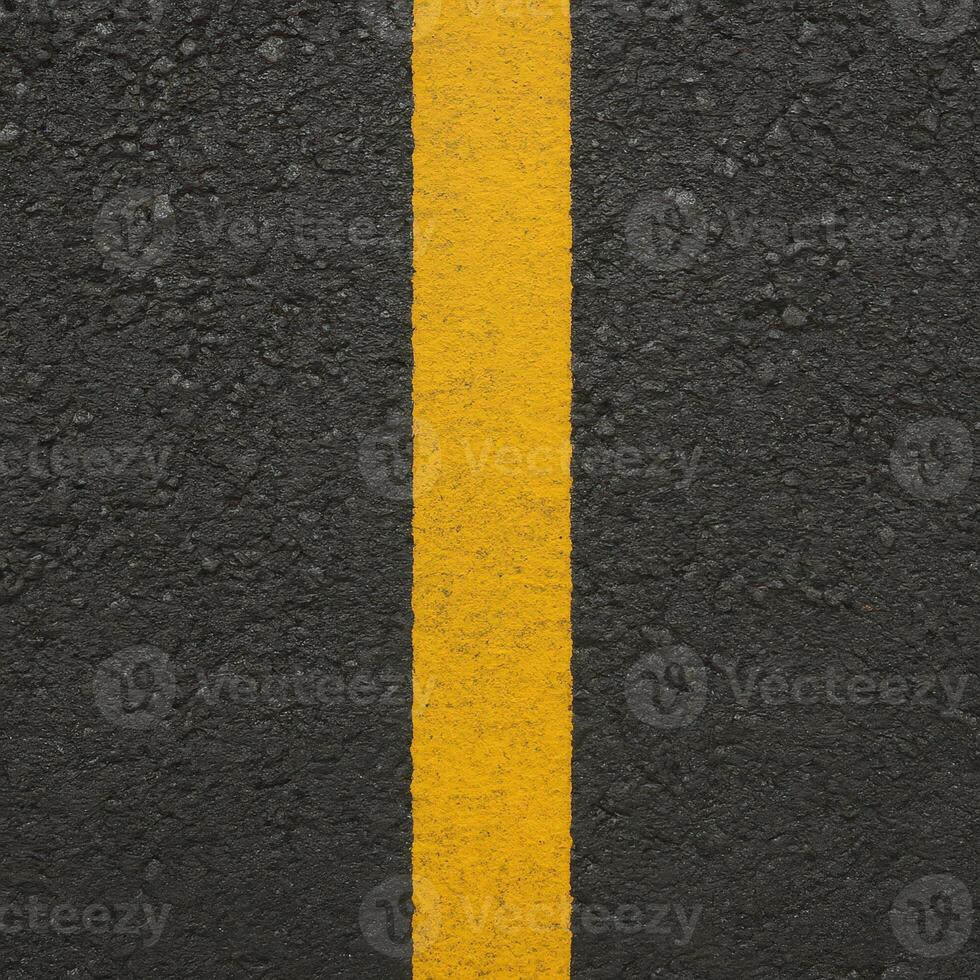 Black Asphalt Road Surface Texture With Yellow Line Top Down View for Urban Design and Infrastructure Themes photo