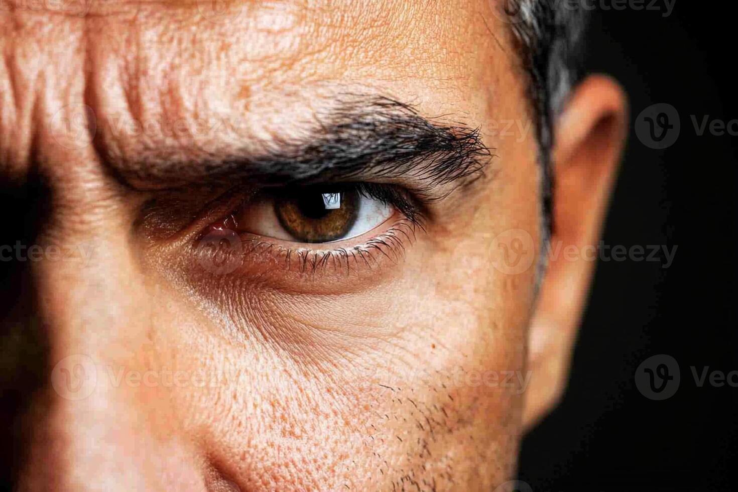 A close up of a man's face with brown eyes photo