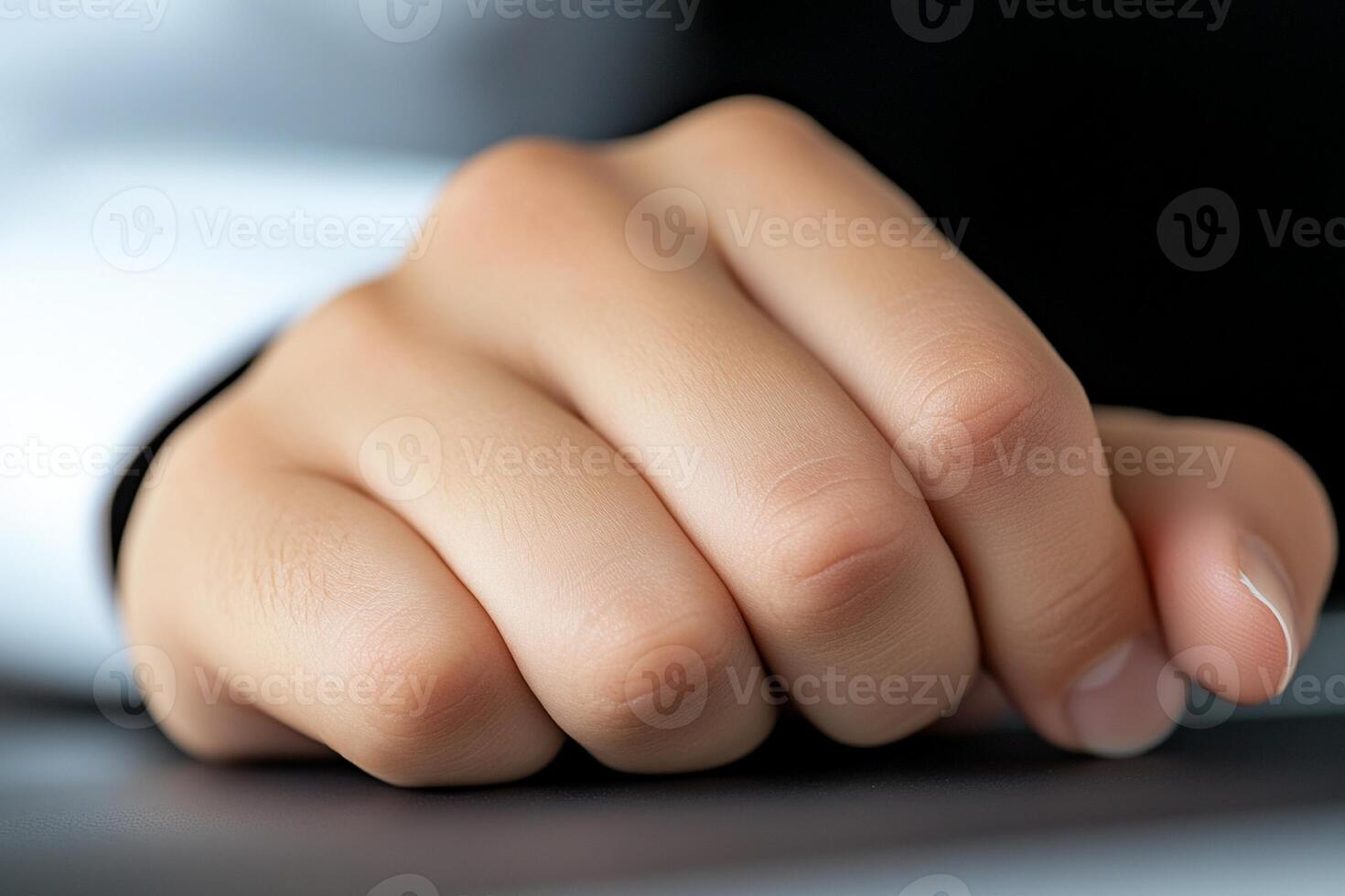A person's hand on a laptop keyboard photo