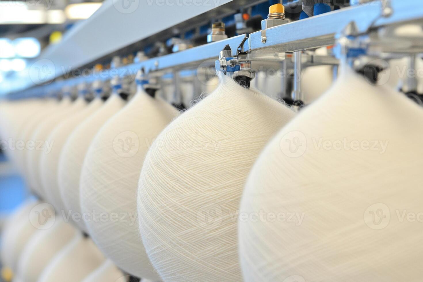 A large number of white balls are being made photo