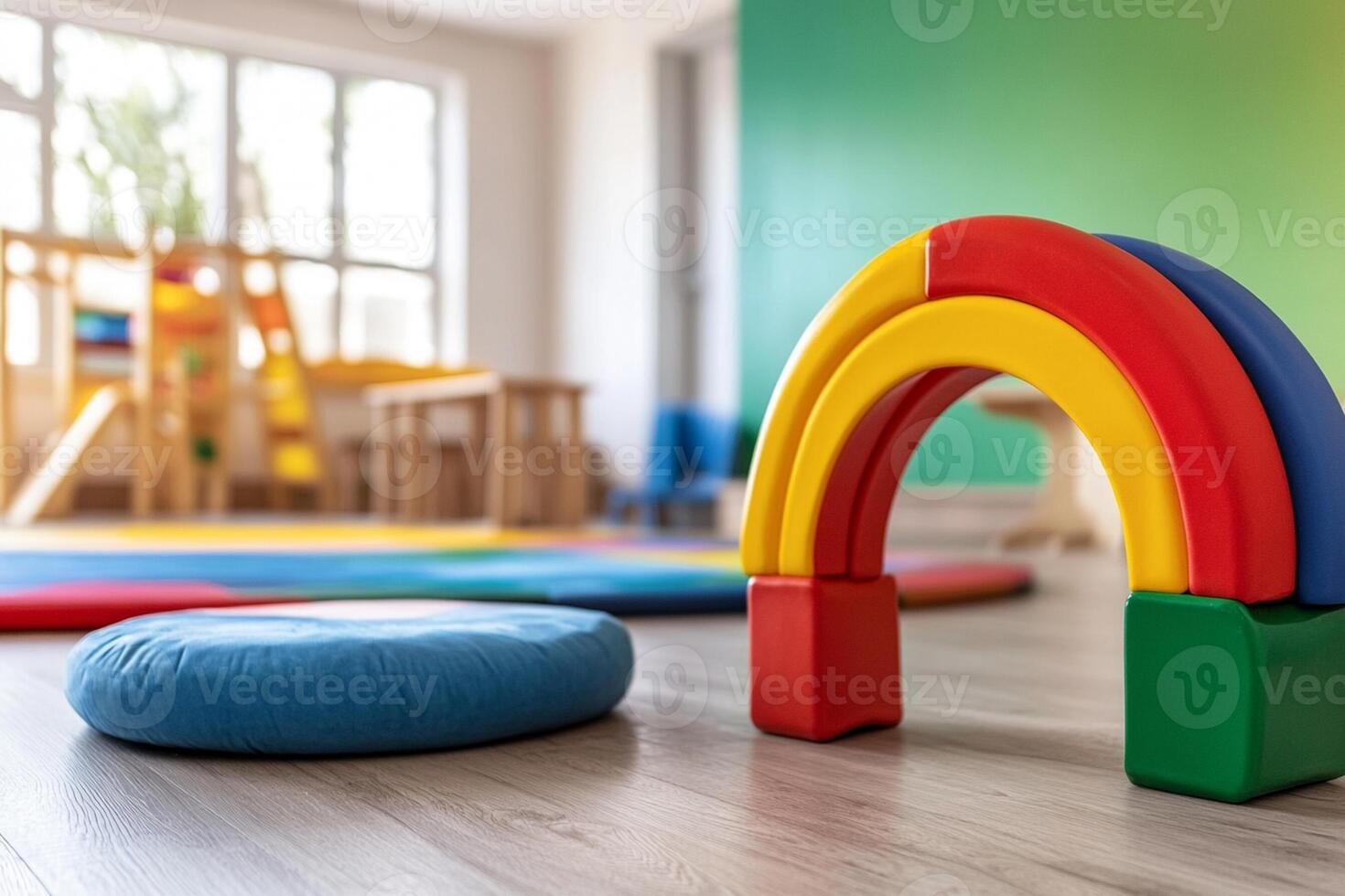 A colorful play area with a rainbow and a toy photo