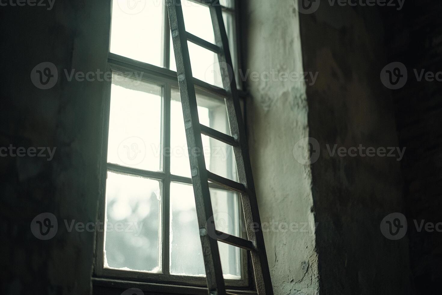 A ladder is sitting next to a window in an old building photo