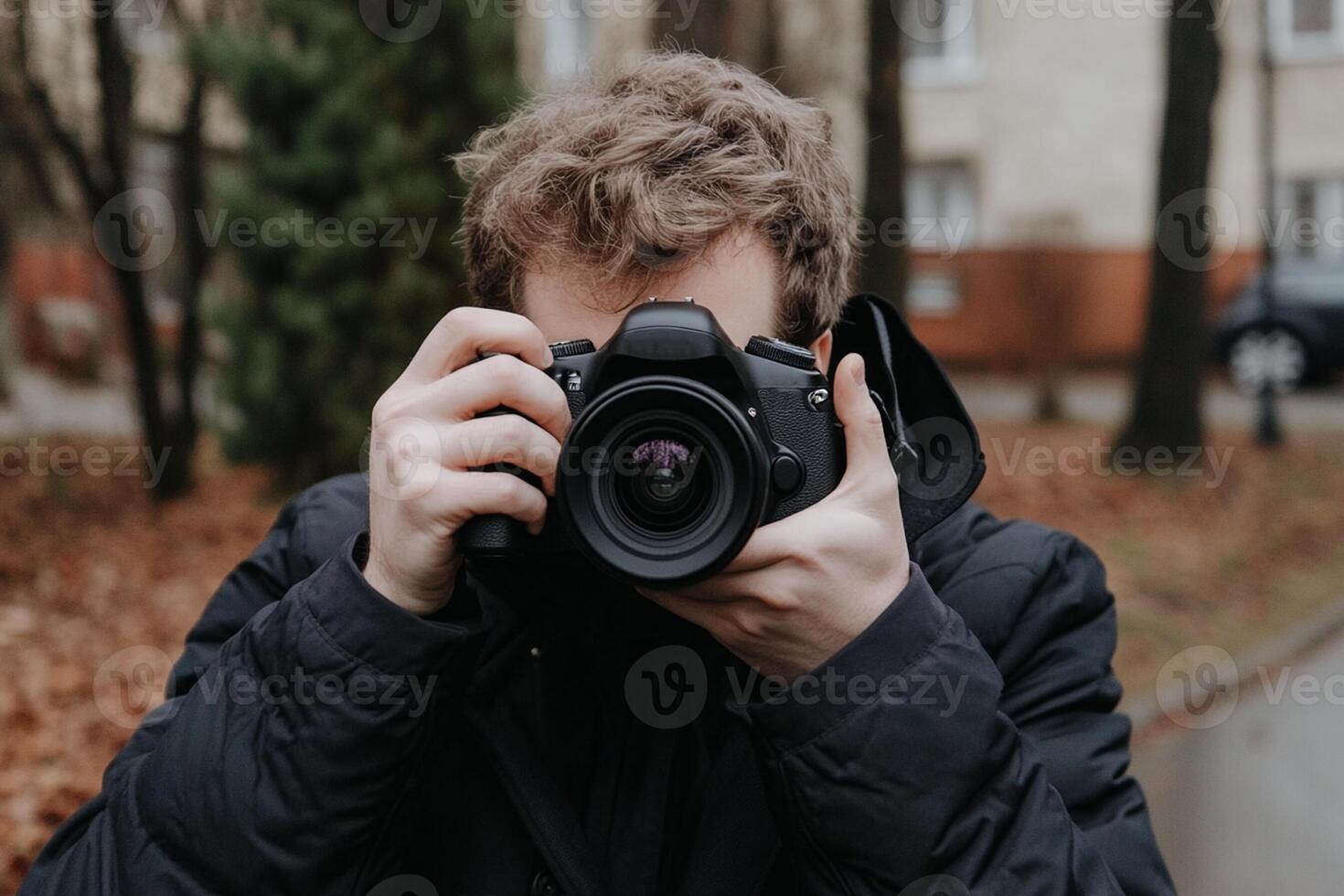 A man taking a photo with his camera