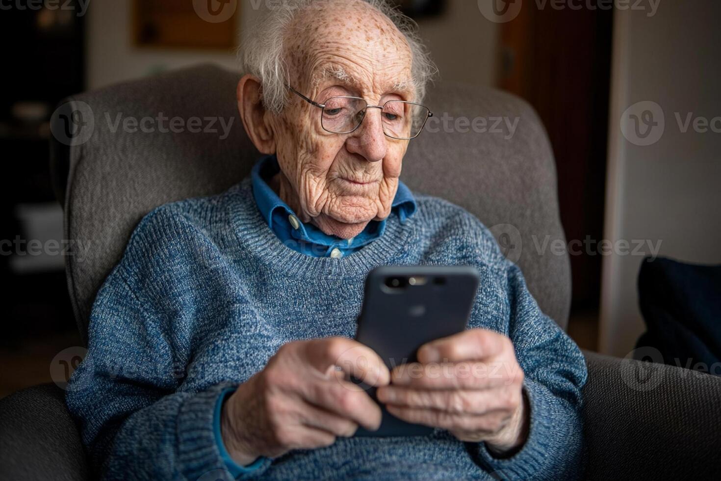 An elderly man is using his phone photo