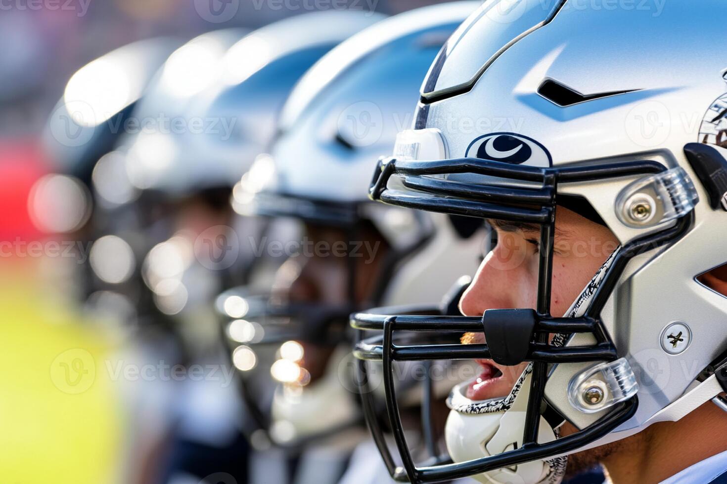 A close up of football players wearing helmets photo