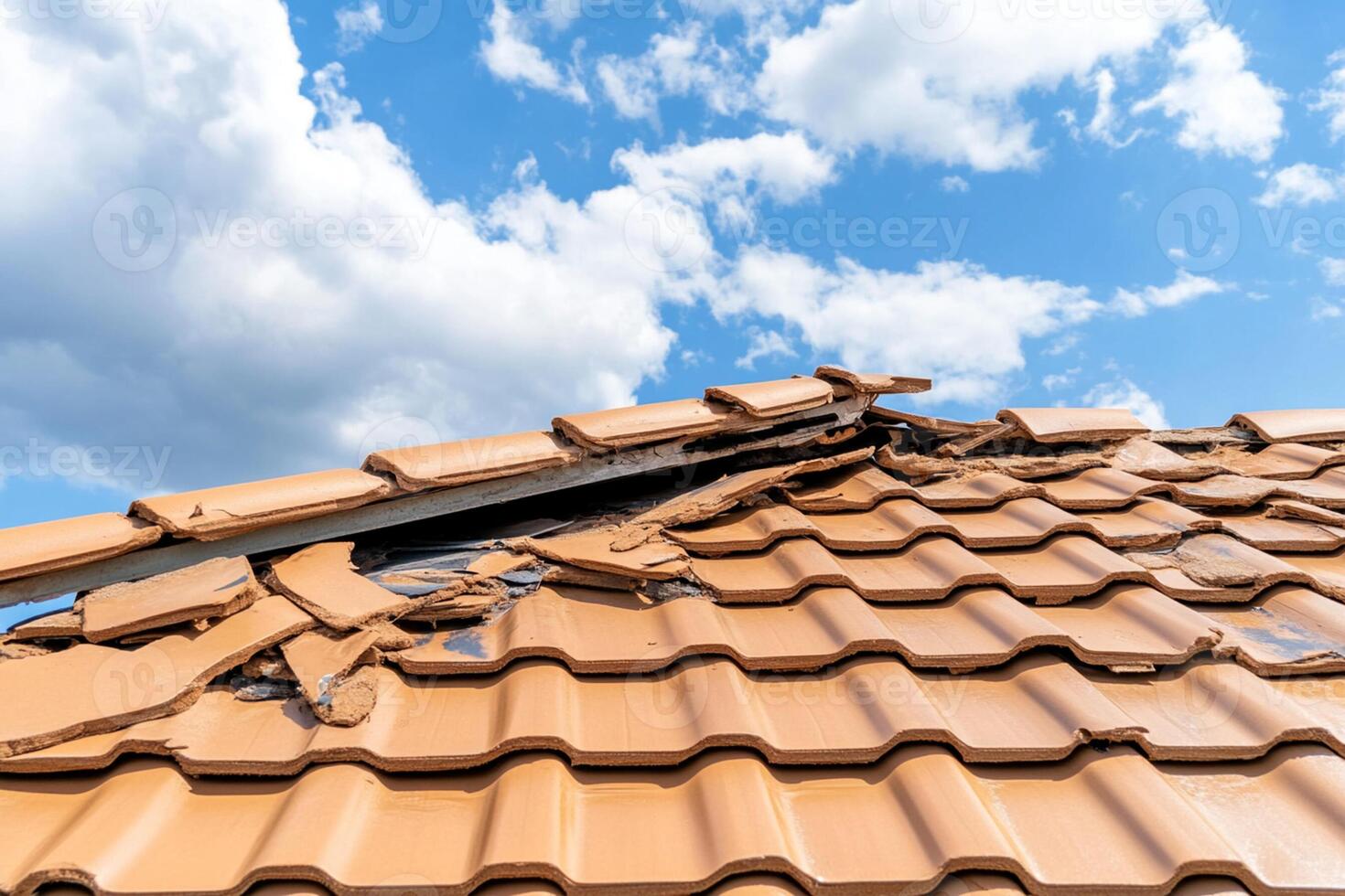 A roof with a broken tile and a broken window photo