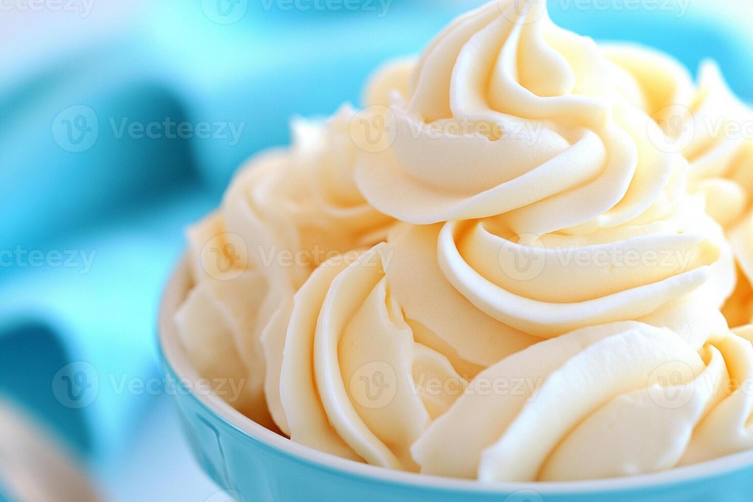 A bowl of whipped cream on a table photo