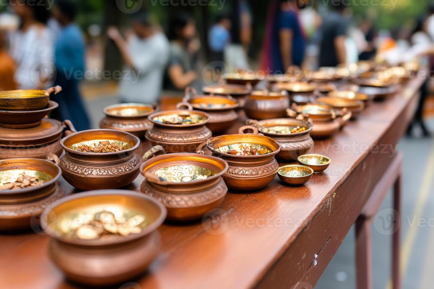 Many bowls and bowls are lined up on a table photo