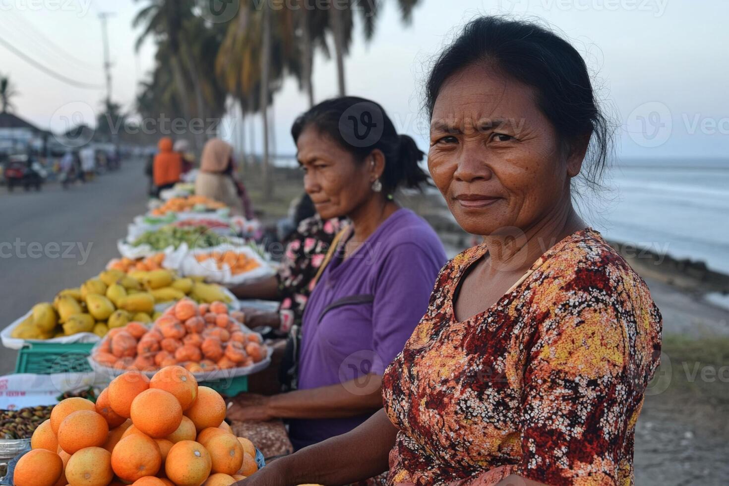 A woman selling fruit on the beach photo