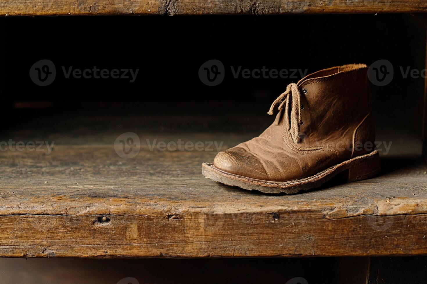 A brown boot sitting on a wooden shelf photo