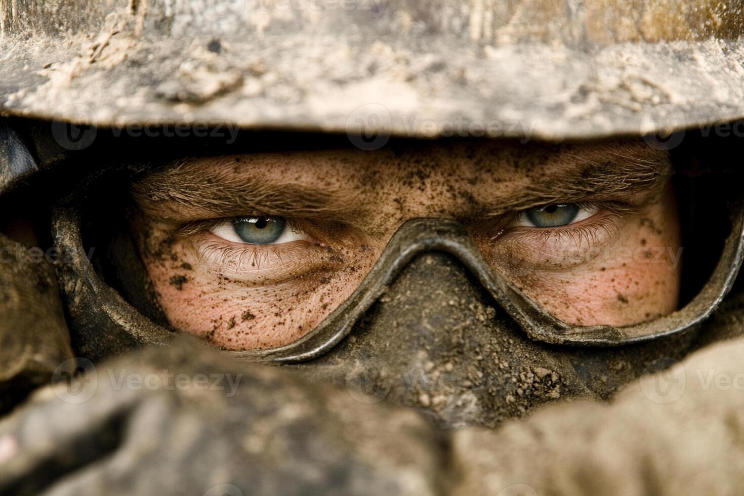 A man in a helmet and goggles looks into the camera photo