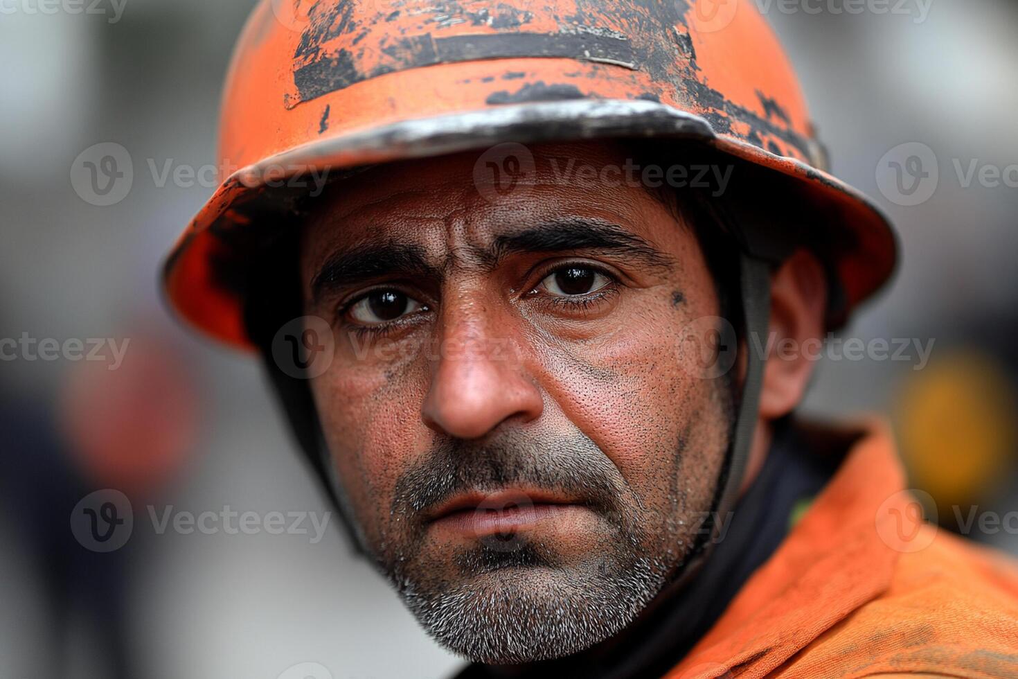A man in an orange hard hat photo