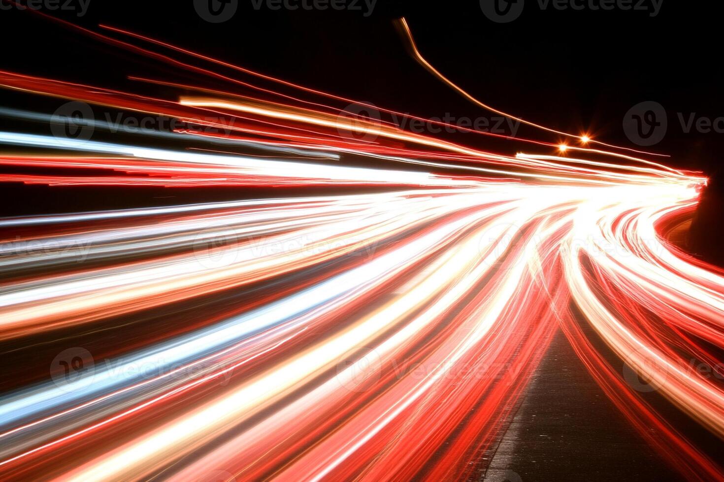 Light trails of cars on a highway at night photo