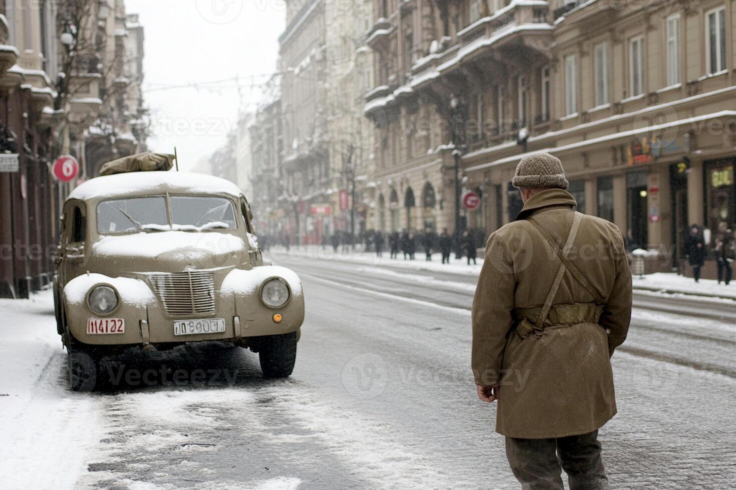 A man walking down a street with a car photo