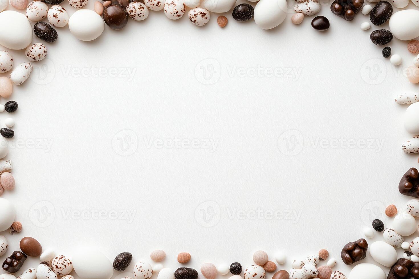A white background with many chocolate eggs and other candy photo