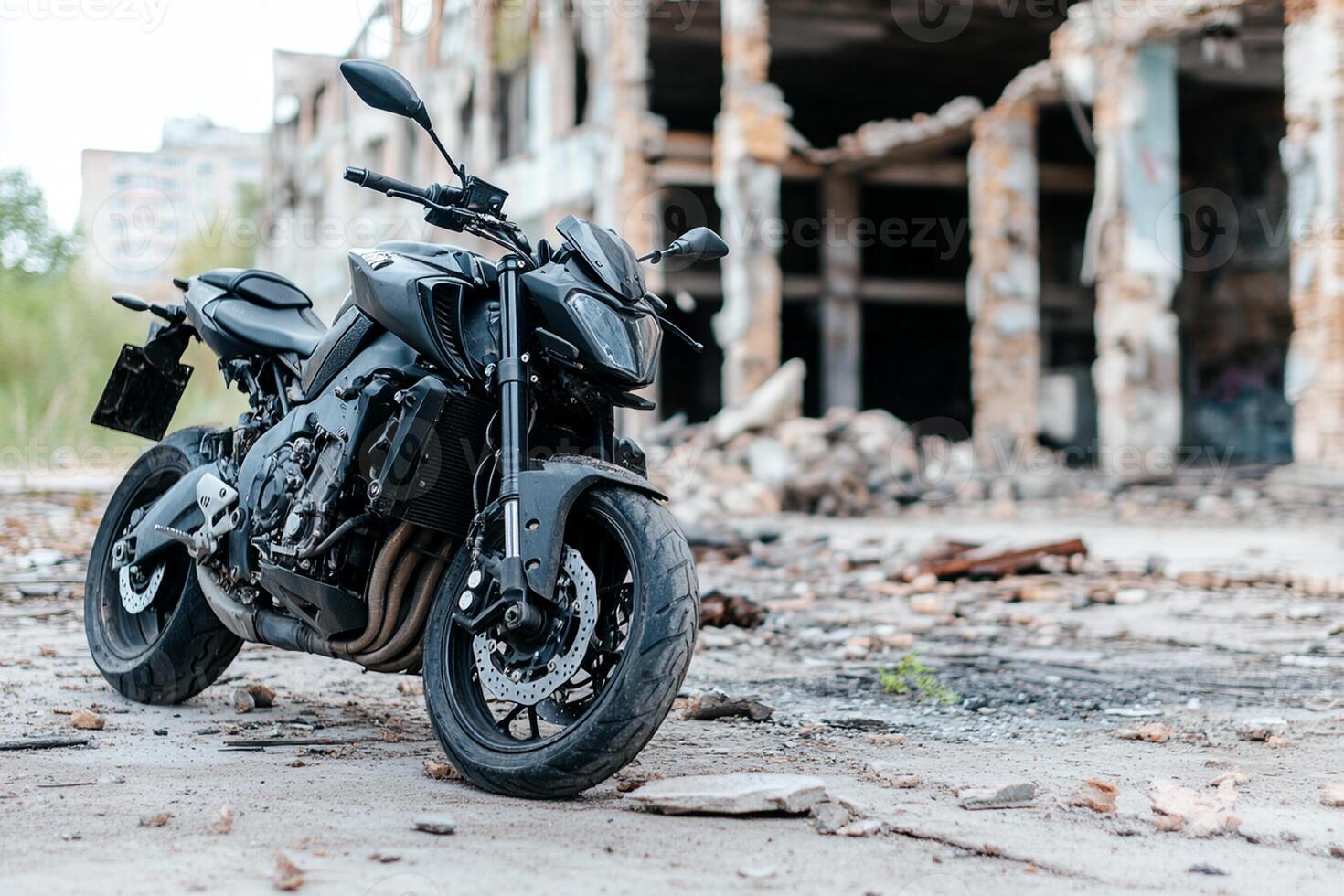 A black motorcycle parked in front of an old building photo