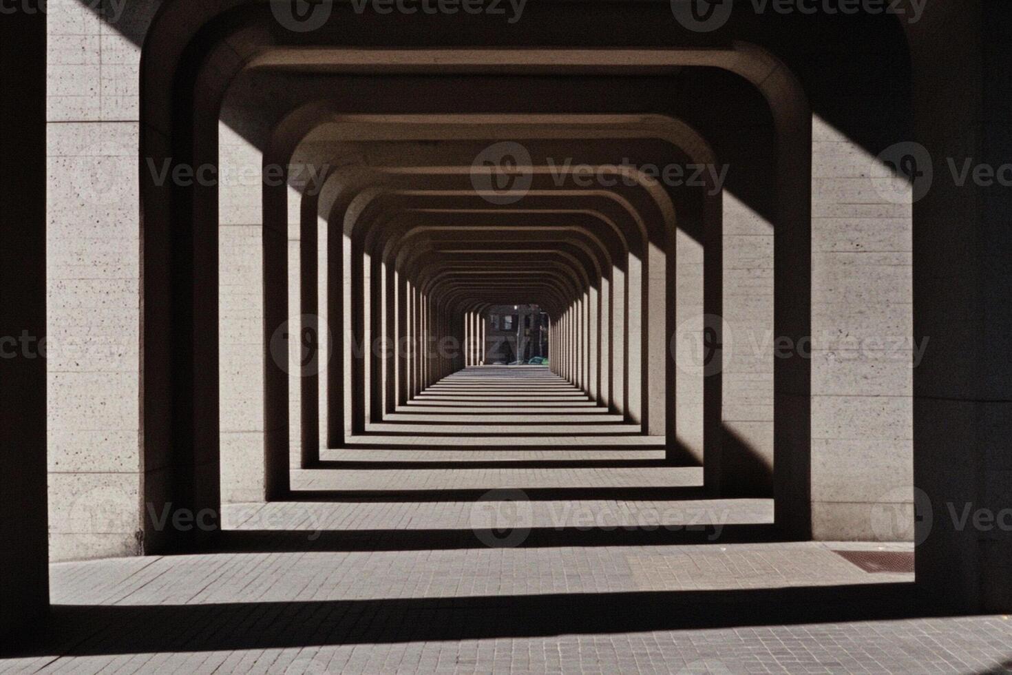 A long tunnel with a light shining through it photo