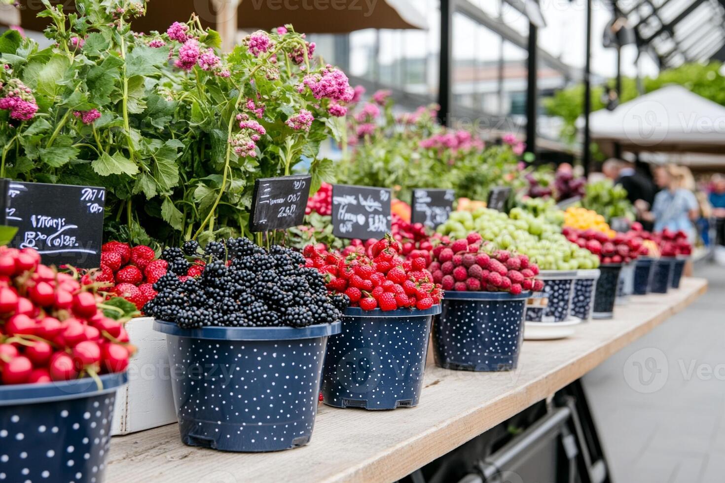 A table with many different types of berries and flowers photo