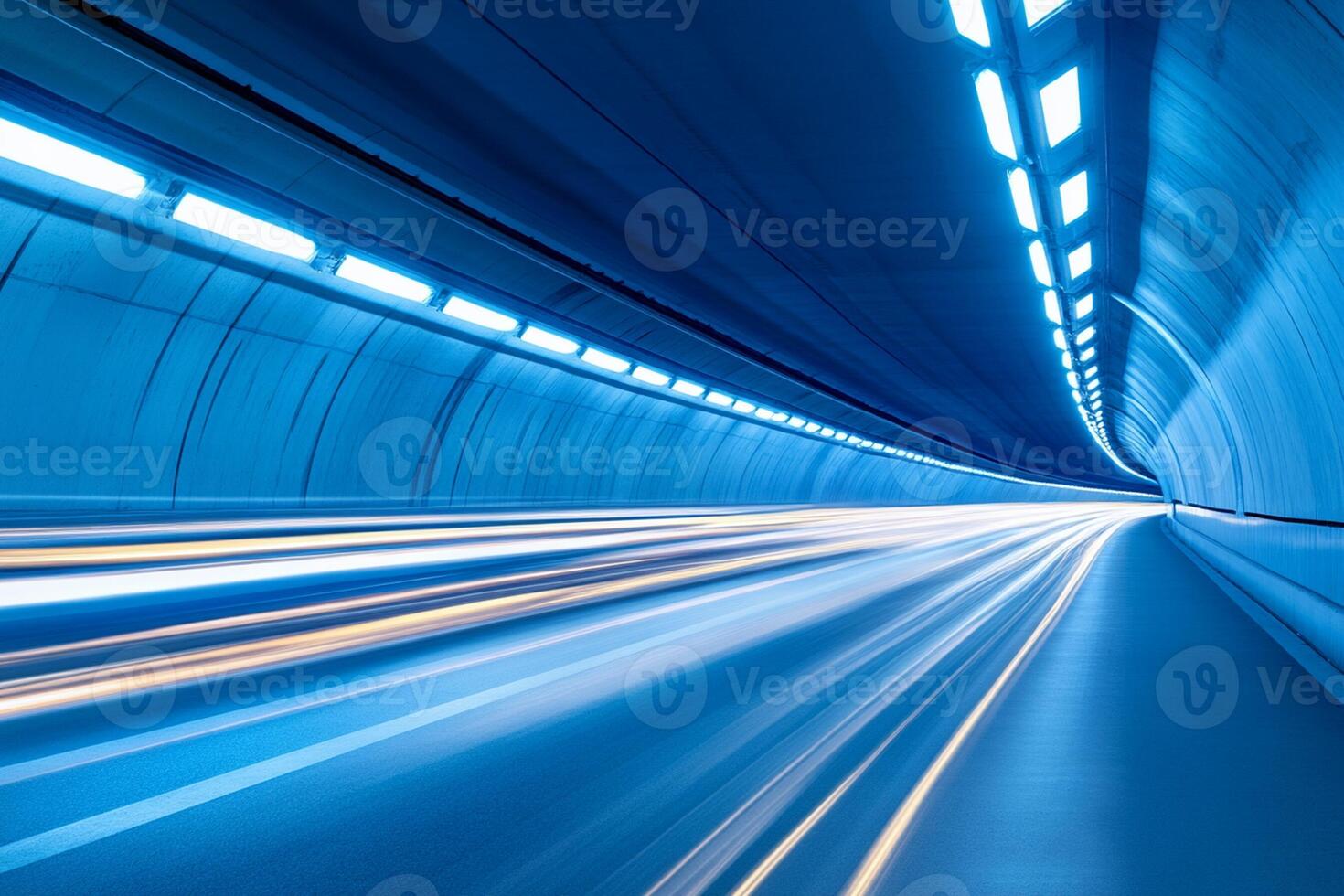 A long tunnel with light trails and cars driving through it photo