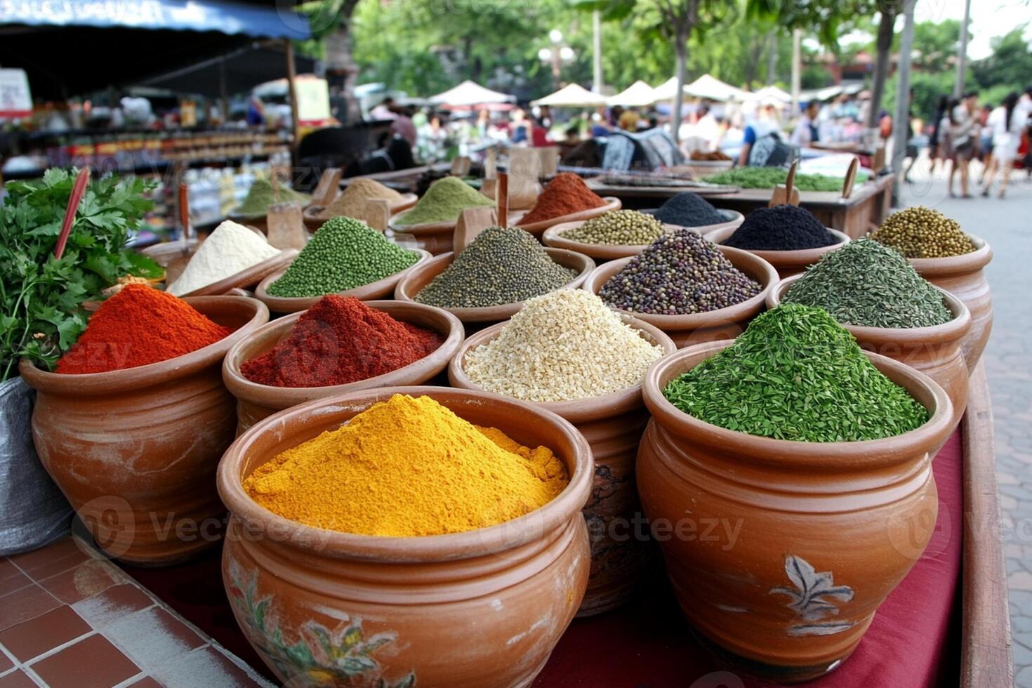 Many pots of different spices are on display photo